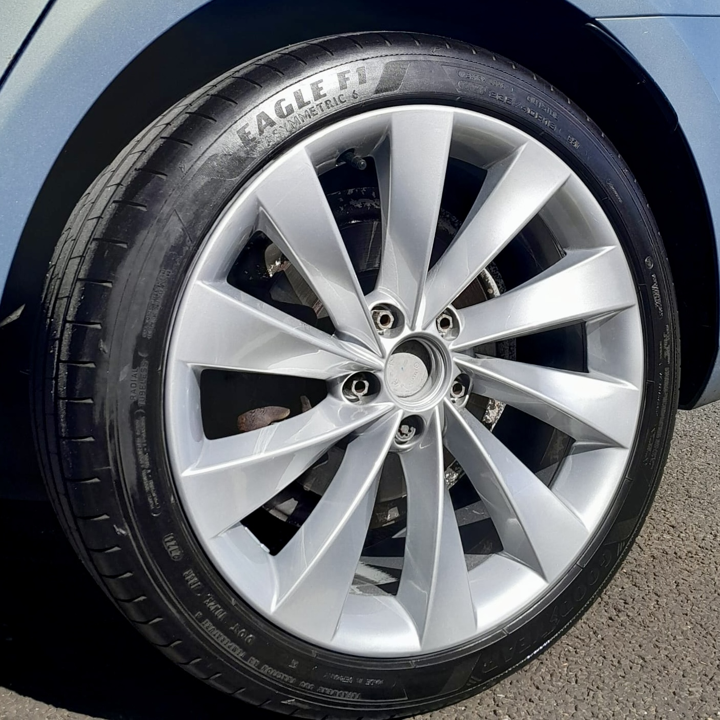 Silver alloy wheel with a freshly refinished face