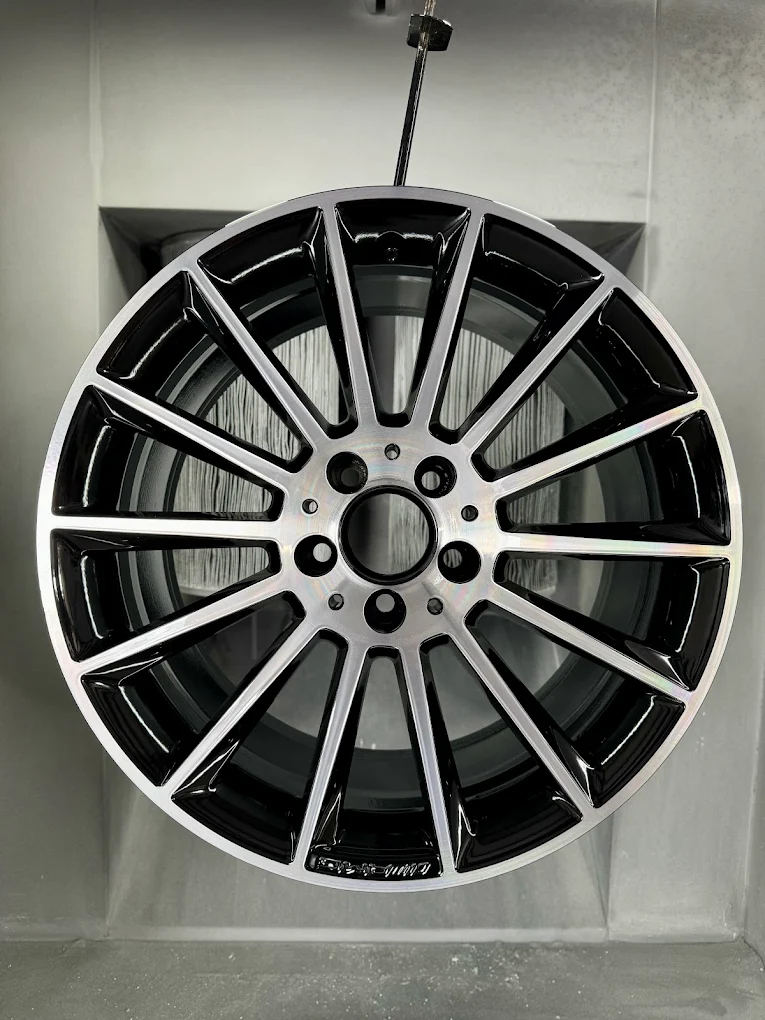 Diamond cut alloy wheel with a machined silver face and black inner sections