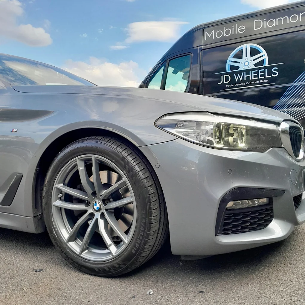 Set of three refinished alloy wheels with dark grey faces and gloss black inner sections